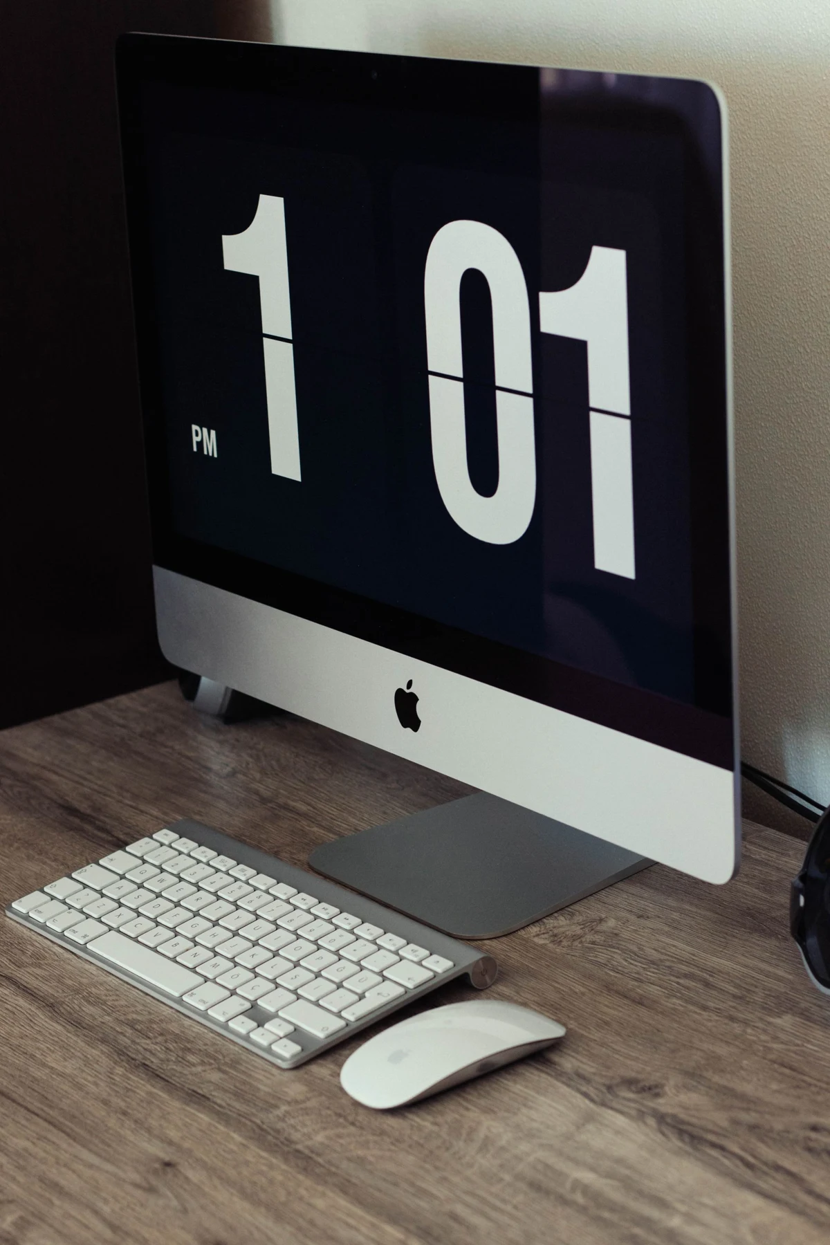 Minimal desktop workspace with a computer and keyboard